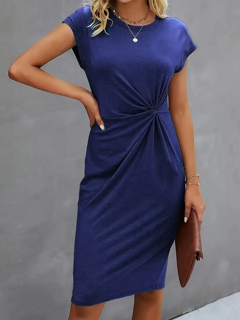 A woman wearing an elegant dress with a flattering ruched design, perfect for both casual outings and formal events. The dress highlights a sophisticated and stylish silhouette, paired with a clutch for a polished look.