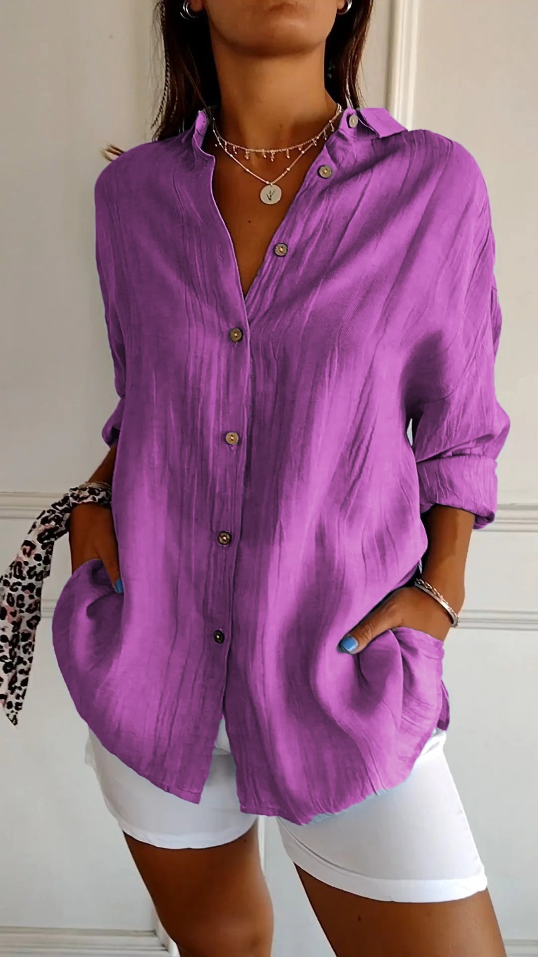 Stylish women's lightweight shirt with a relaxed fit, featuring button details and a casual, versatile design ideal for everyday wear.