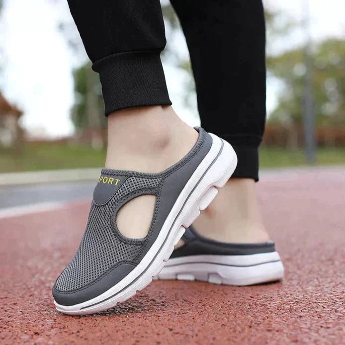 Image showing women's sporty sneakers with a breathable mesh design, featuring an open-toe and slip-on style, perfect for casual wear or active lifestyles.