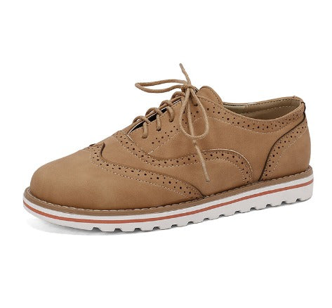 Image showing women's classic sneakers with a stylish brogue design, featuring lace-up closure and a comfortable sole, perfect for casual wear.