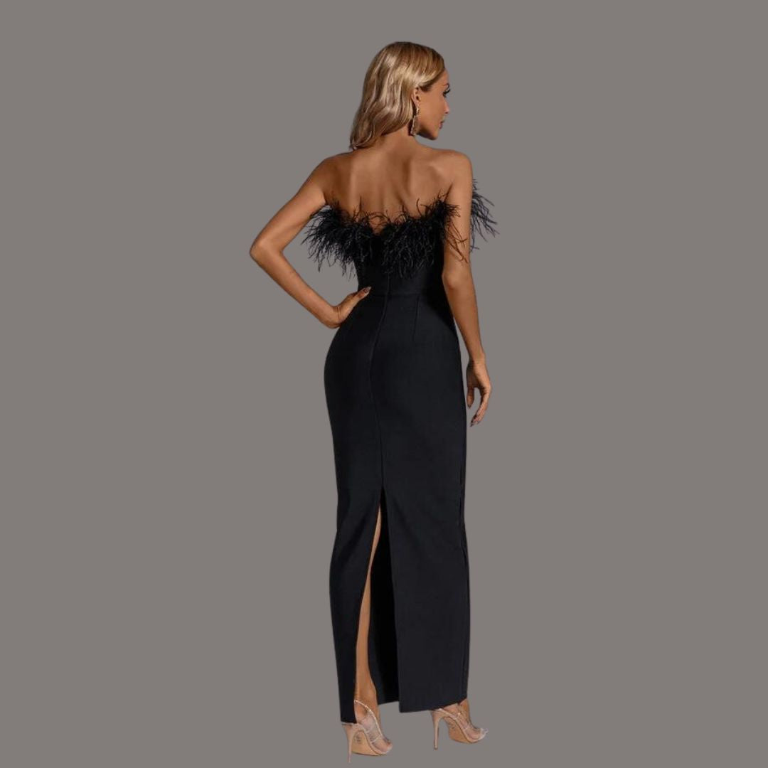 A woman showcasing the Camille Women's Feathered Evening Dress, featuring elegant feather detailing at the neckline and a sleek, form-fitting gown design, perfect for formal occasions or special events.