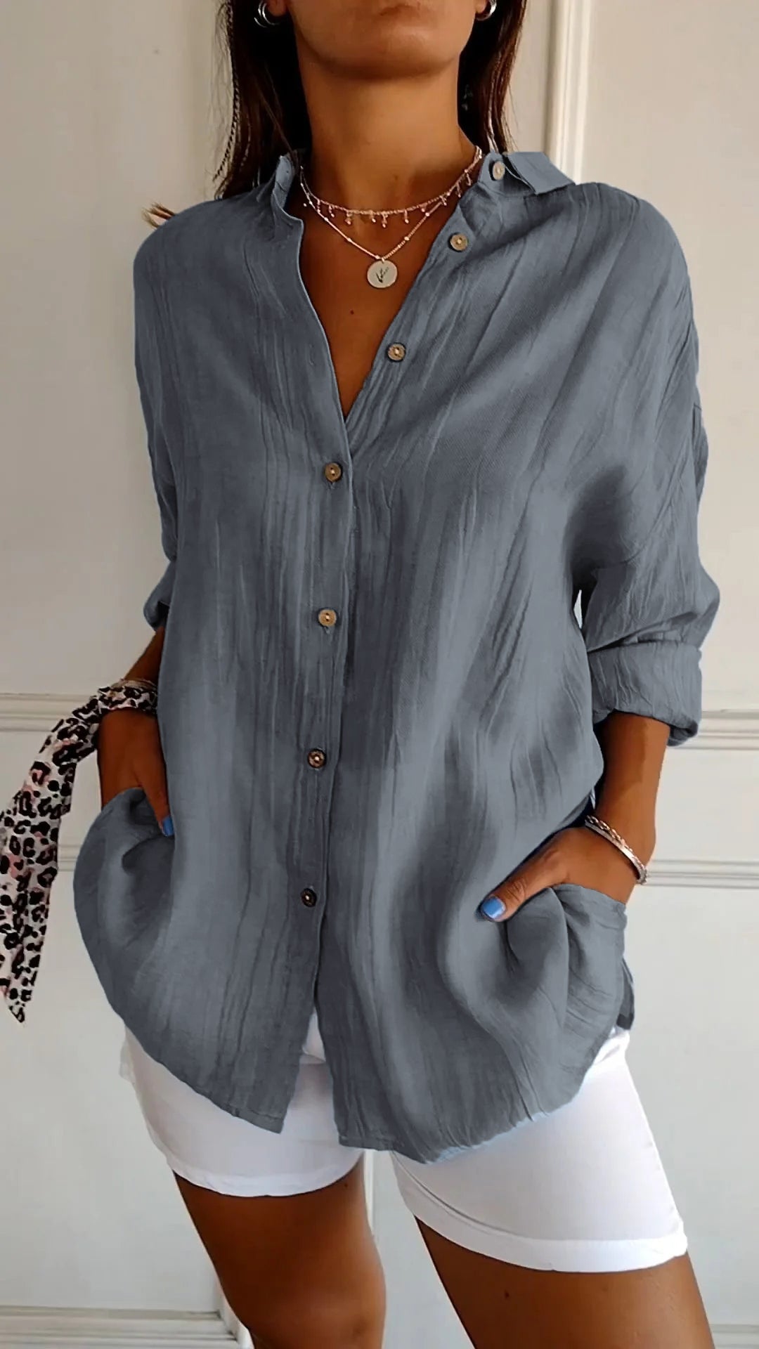 Stylish women's lightweight shirt with a relaxed fit, featuring button details and a casual, versatile design ideal for everyday wear.