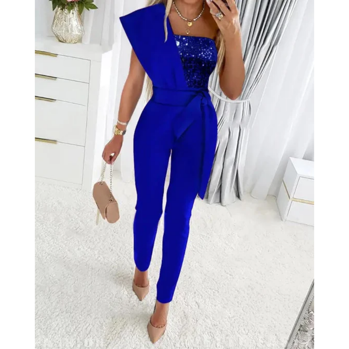A Sophia's One-Shoulder Sequin Jumpsuit Party wear with a fitted silhouette, featuring shimmering sequins throughout and a sleek, modern design perfect for evening events or special occasions.