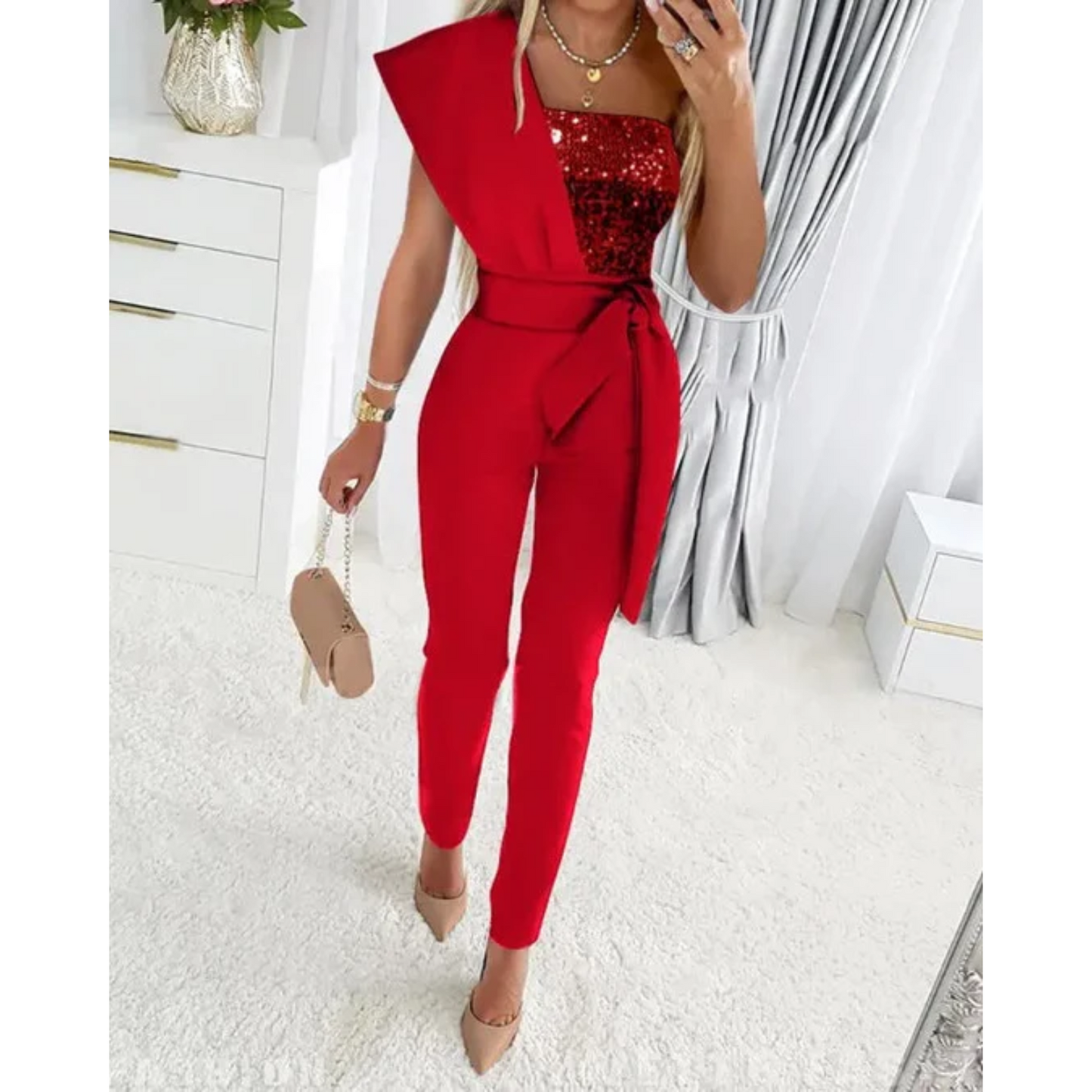 A Sophia's One-Shoulder Sequin Jumpsuit Party wear with a fitted silhouette, featuring shimmering sequins throughout and a sleek, modern design perfect for evening events or special occasions.