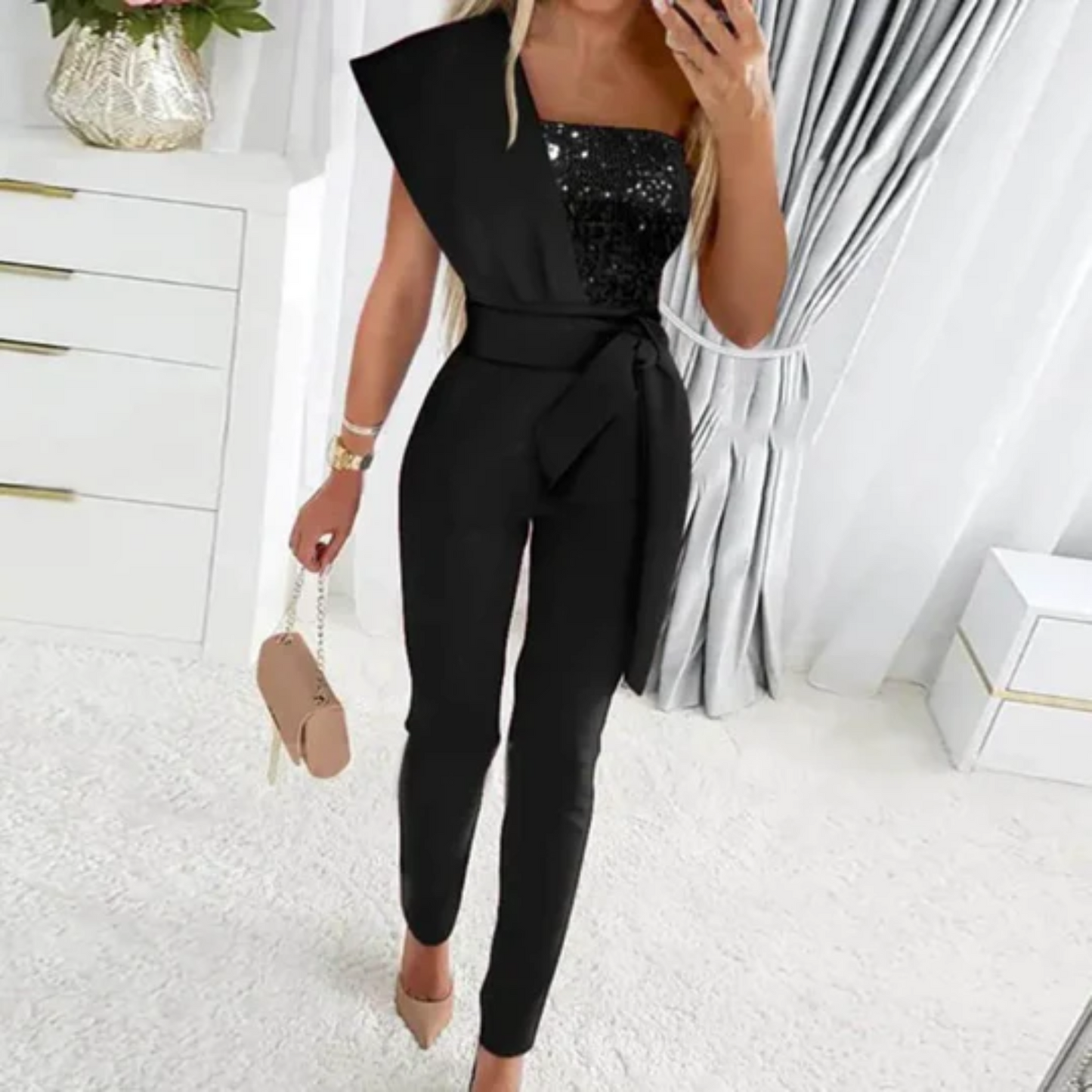 A Sophia's One-Shoulder Sequin Jumpsuit Party wear with a fitted silhouette, featuring shimmering sequins throughout and a sleek, modern design perfect for evening events or special occasions.