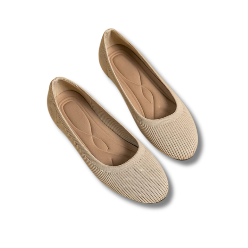 A pair of women's comfortable flat shoes designed with a ribbed texture and cushioned insoles, perfect for everyday wear.