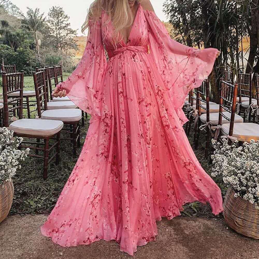 Model wearing the Isabella | Flowing Bohemian Maxi Dress, featuring a flowing silhouette and bell sleeves, perfect for capturing a romantic, free-spirited look at any special occasion or outdoor event.