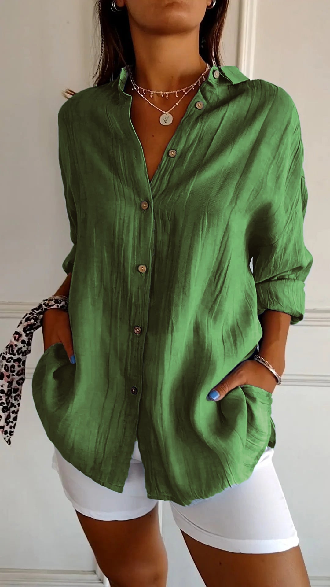 Stylish women's lightweight shirt with a relaxed fit, featuring button details and a casual, versatile design ideal for everyday wear.