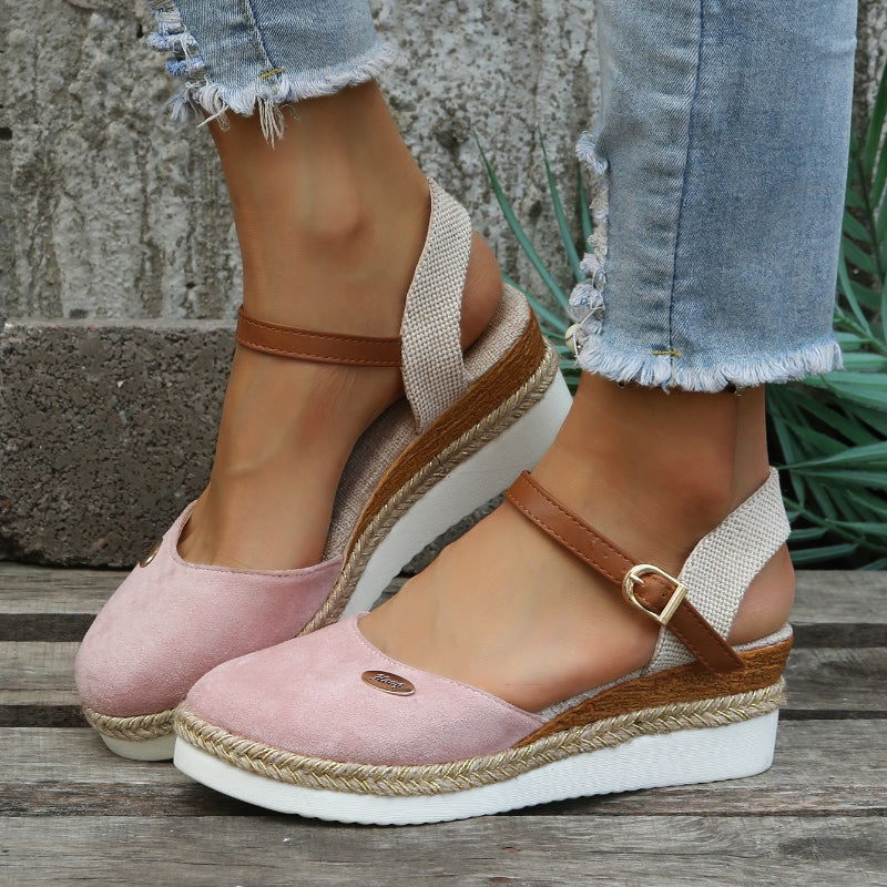 An image showcasing stylish women's wedge sandals with a comfortable design, featuring adjustable ankle straps and a supportive sole, perfect for casual or semi-formal outings.