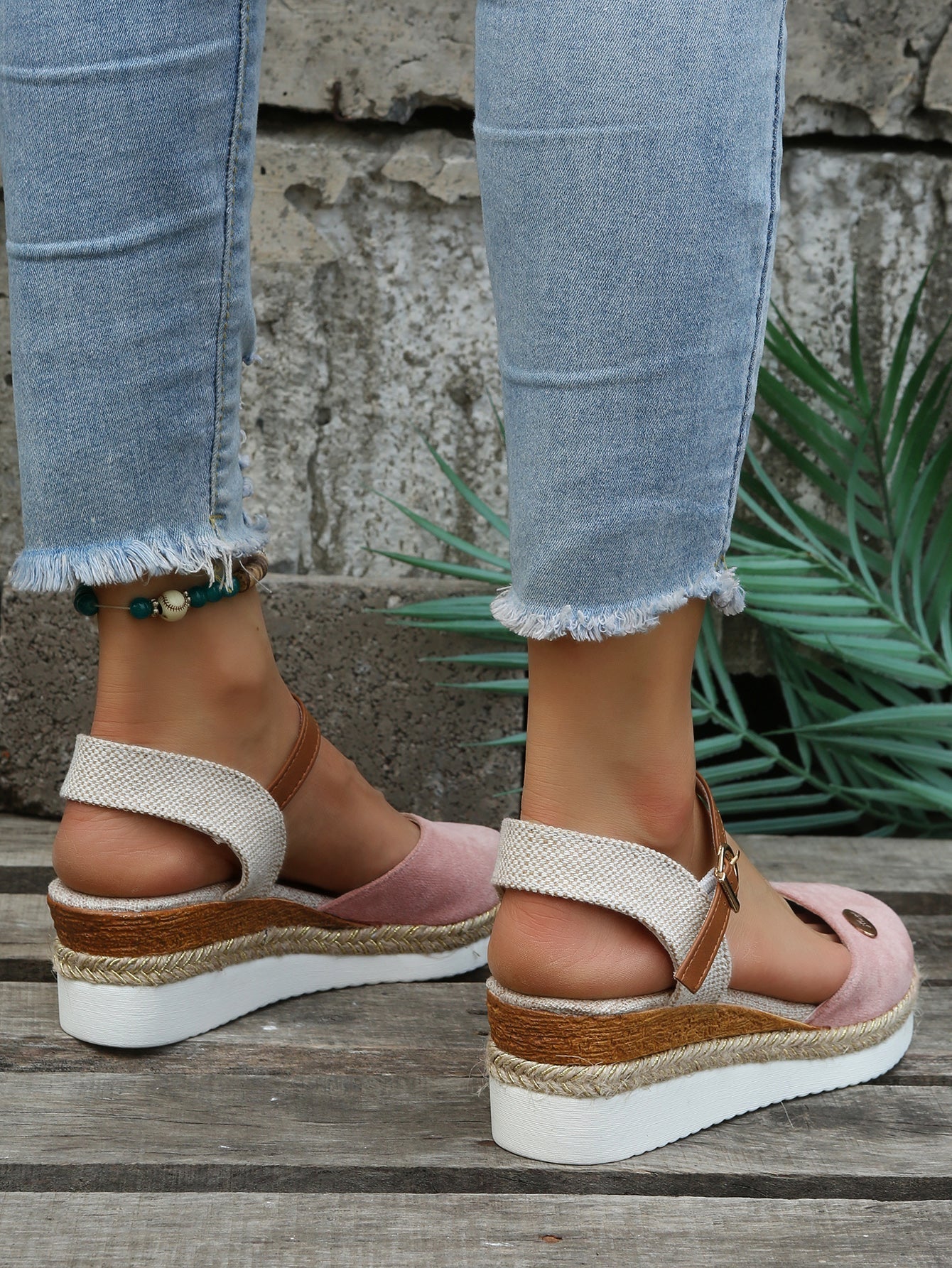 An image showcasing stylish women's wedge sandals with a comfortable design, featuring adjustable ankle straps and a supportive sole, perfect for casual or semi-formal outings.