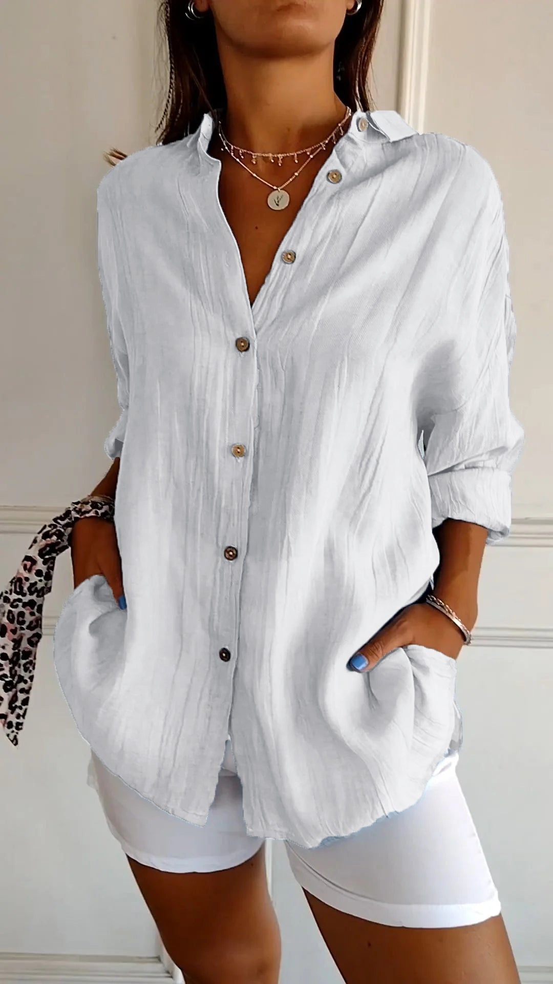 Stylish women's lightweight shirt with a relaxed fit, featuring button details and a casual, versatile design ideal for everyday wear.