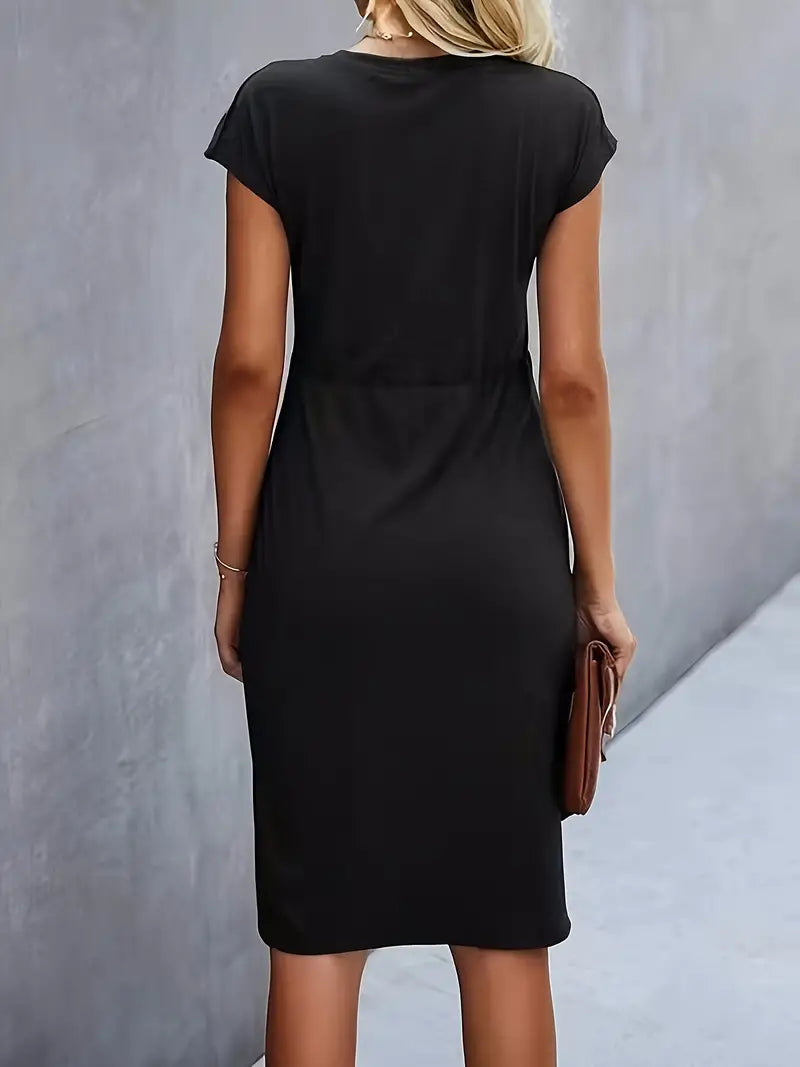A woman wearing an elegant dress with a flattering ruched design, perfect for both casual outings and formal events. The dress highlights a sophisticated and stylish silhouette, paired with a clutch for a polished look.