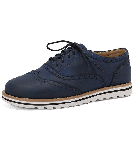 Image showing women's classic sneakers with a stylish brogue design, featuring lace-up closure and a comfortable sole, perfect for casual wear.