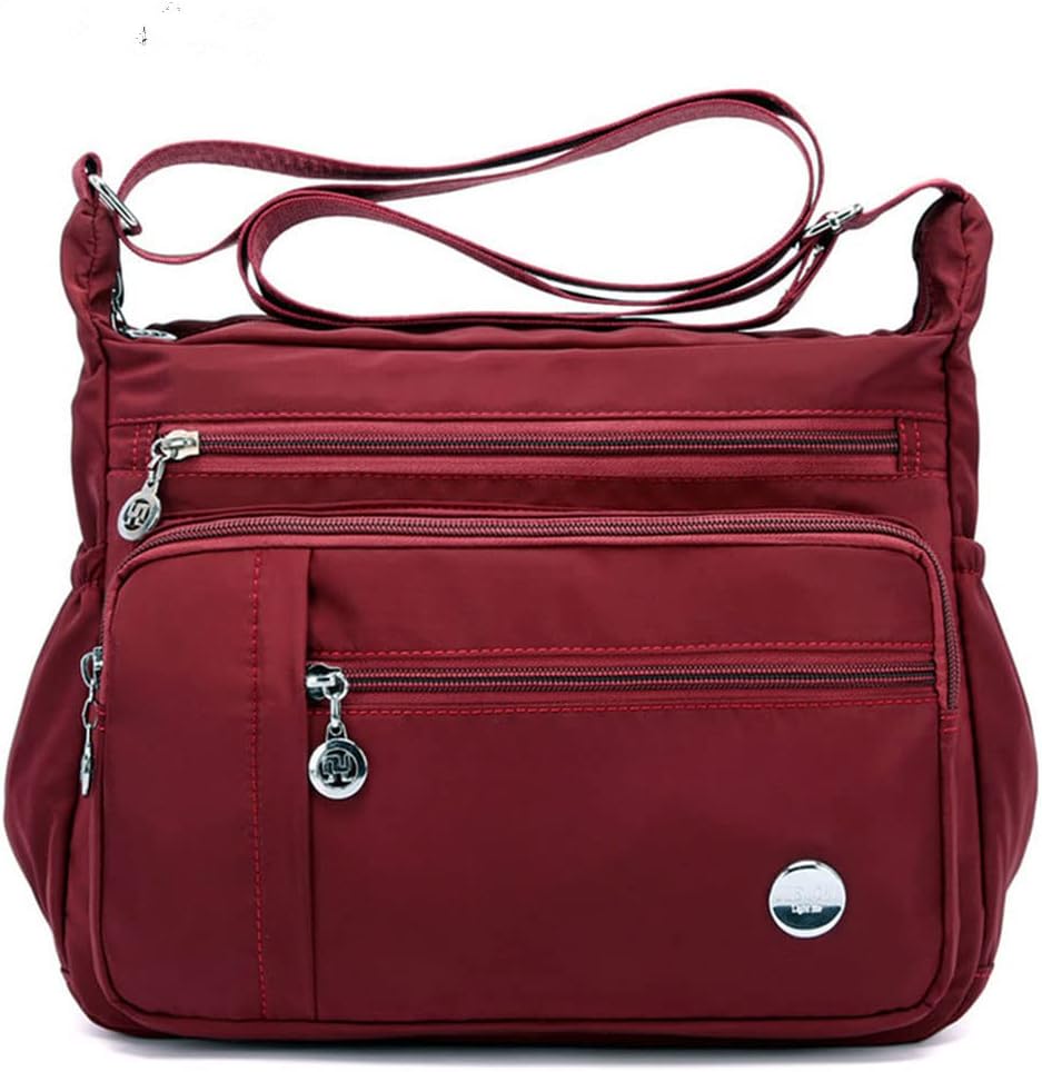 Functional multi-pocket bag with adjustable strap, multiple zippered compartments, and side pockets, offering ample space for daily essentials. Compact and lightweight design for easy carrying. Perfect for organization and travel use.