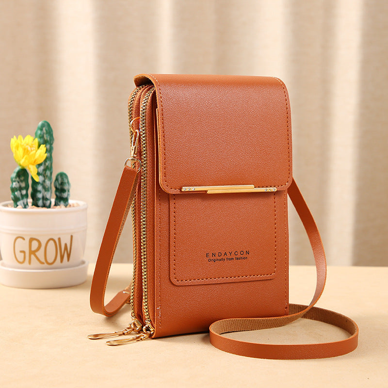 Image showing a compact and stylish women's crossbody bag with a sleek design, featuring a front flap, zipper closure, and an adjustable strap, ideal for carrying essentials on the go.