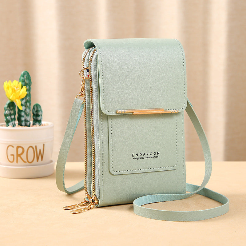 Image showing a compact and stylish women's crossbody bag with a sleek design, featuring a front flap, zipper closure, and an adjustable strap, ideal for carrying essentials on the go.