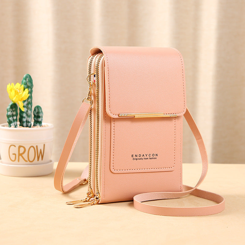 Image showing a compact and stylish women's crossbody bag with a sleek design, featuring a front flap, zipper closure, and an adjustable strap, ideal for carrying essentials on the go.