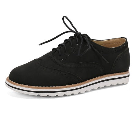 Image showing women's classic sneakers with a stylish brogue design, featuring lace-up closure and a comfortable sole, perfect for casual wear.