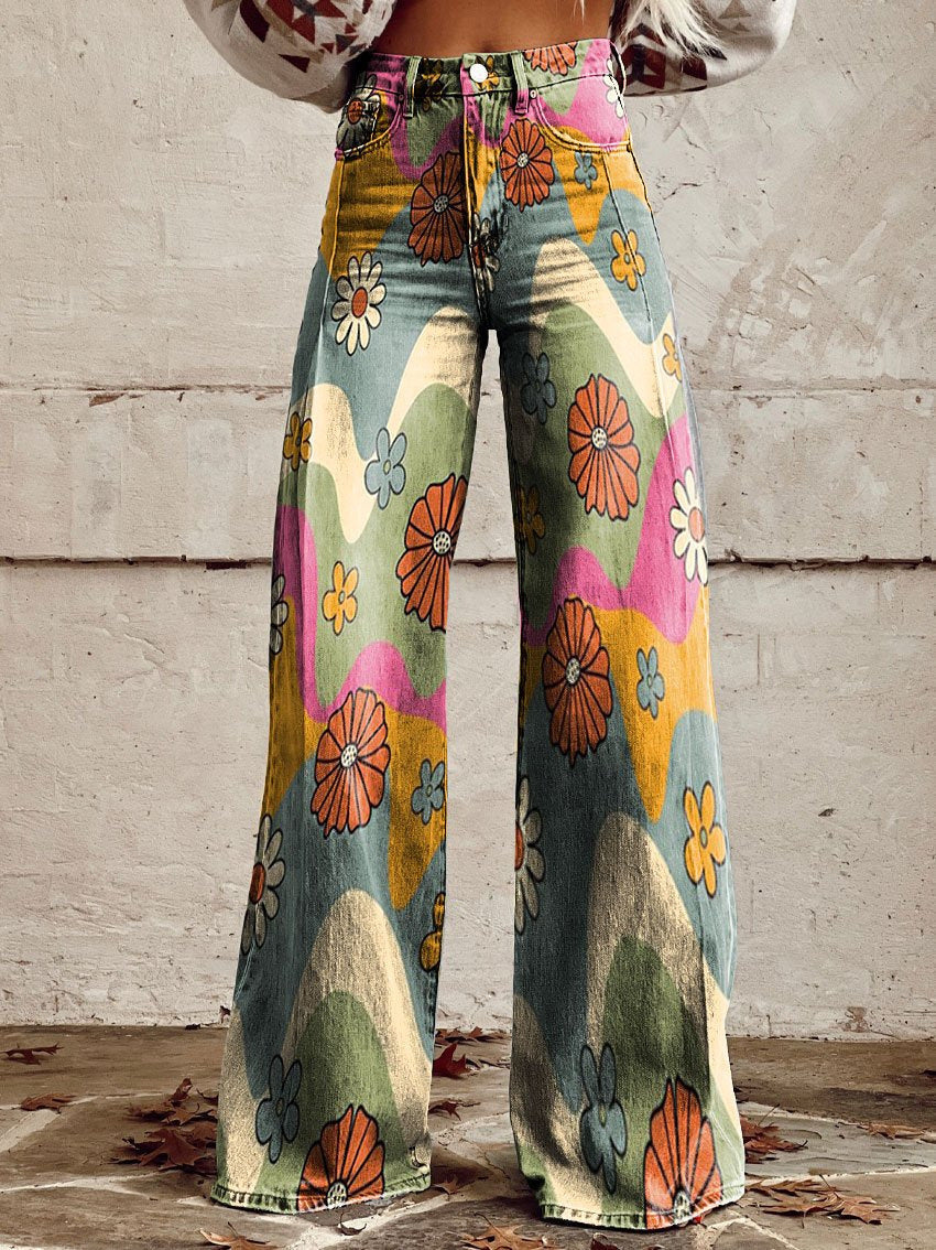 A pair of Jasmine Women's Boho Wide-Leg Pants featuring a bold floral print with nature-inspired patterns, including flowers and butterflies. These wide-leg pants have a relaxed fit, perfect for adding a boho touch to any casual or festival outfit.