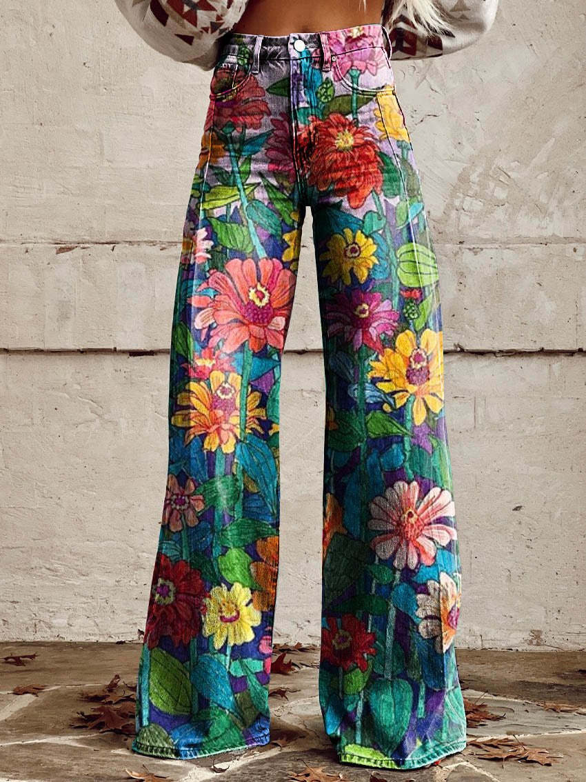 A pair of Jasmine Women's Boho Wide-Leg Pants featuring a bold floral print with nature-inspired patterns, including flowers and butterflies. These wide-leg pants have a relaxed fit, perfect for adding a boho touch to any casual or festival outfit.