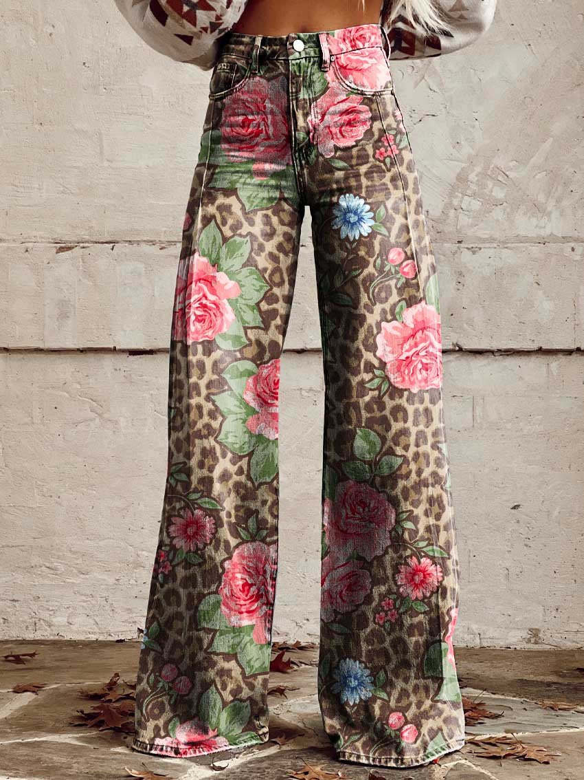 A pair of Jasmine Women's Boho Wide-Leg Pants featuring a bold floral print with nature-inspired patterns, including flowers and butterflies. These wide-leg pants have a relaxed fit, perfect for adding a boho touch to any casual or festival outfit.
