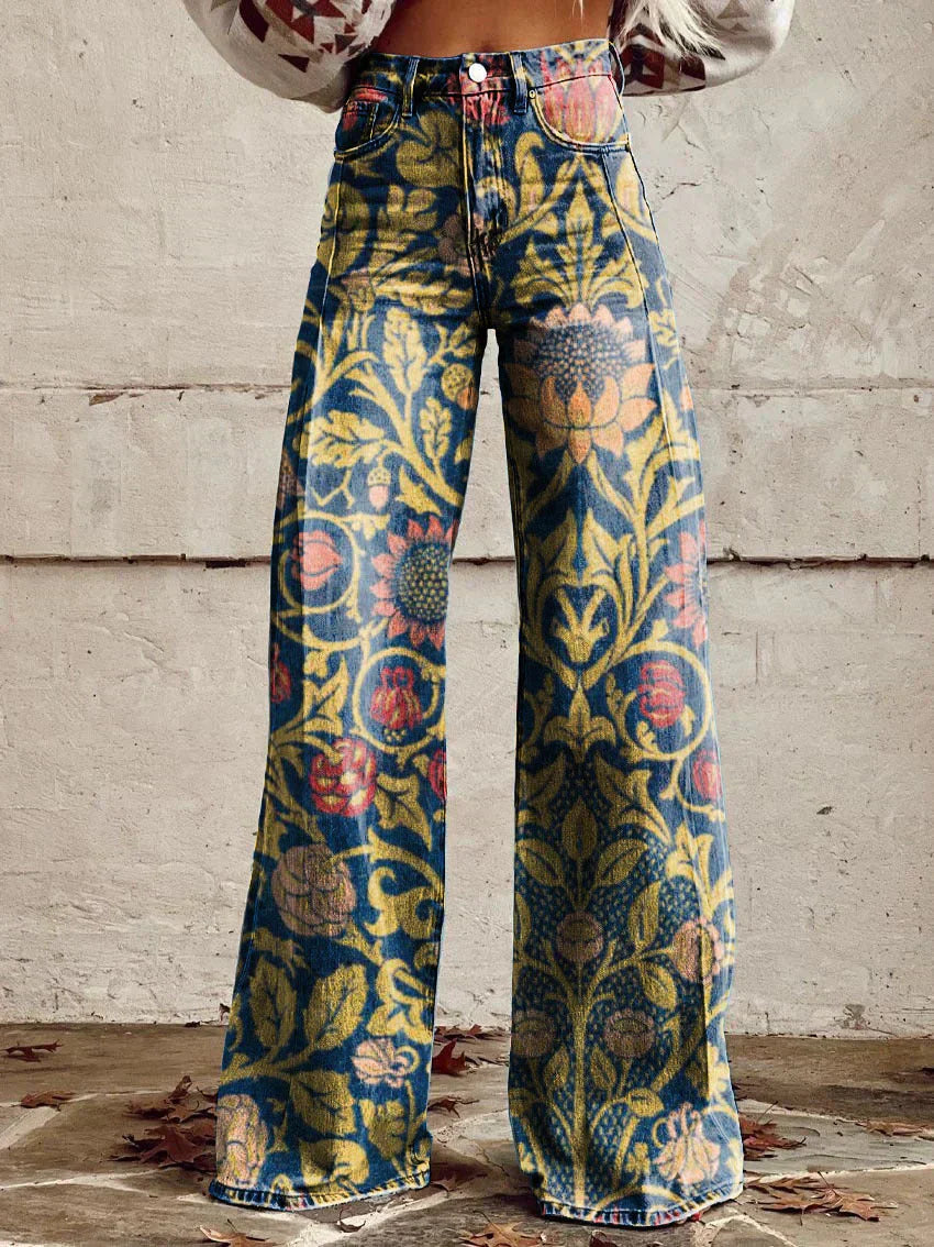 A pair of Jasmine Women's Boho Wide-Leg Pants featuring a bold floral print with nature-inspired patterns, including flowers and butterflies. These wide-leg pants have a relaxed fit, perfect for adding a boho touch to any casual or festival outfit.