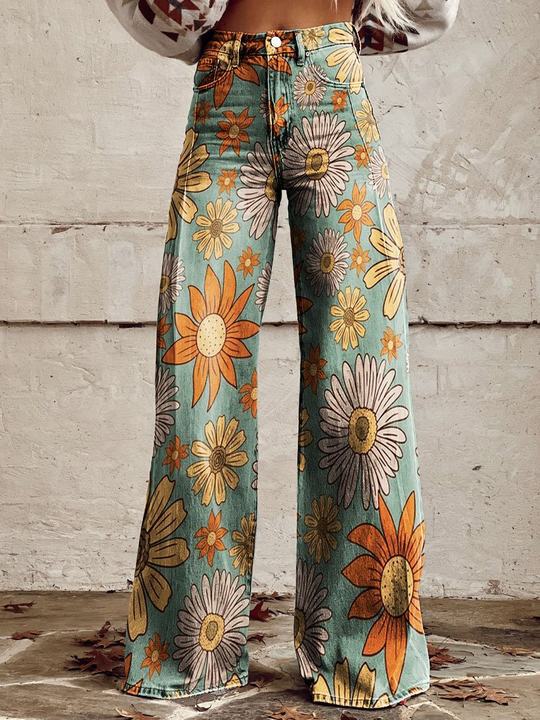 A pair of Jasmine Women's Boho Wide-Leg Pants featuring a bold floral print with nature-inspired patterns, including flowers and butterflies. These wide-leg pants have a relaxed fit, perfect for adding a boho touch to any casual or festival outfit.