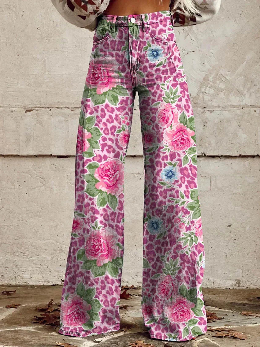 A pair of Jasmine Women's Boho Wide-Leg Pants featuring a bold floral print with nature-inspired patterns, including flowers and butterflies. These wide-leg pants have a relaxed fit, perfect for adding a boho touch to any casual or festival outfit.