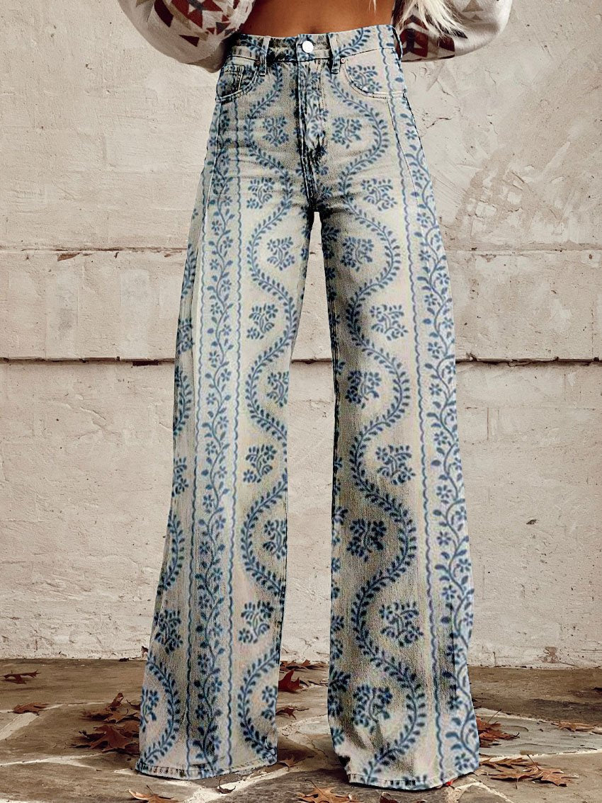A pair of Jasmine Women's Boho Wide-Leg Pants featuring a bold floral print with nature-inspired patterns, including flowers and butterflies. These wide-leg pants have a relaxed fit, perfect for adding a boho touch to any casual or festival outfit.