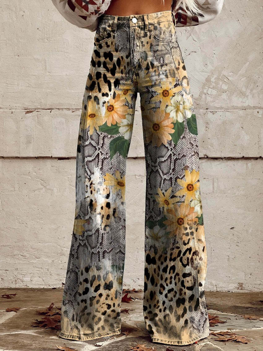 A pair of Jasmine Women's Boho Wide-Leg Pants featuring a bold floral print with nature-inspired patterns, including flowers and butterflies. These wide-leg pants have a relaxed fit, perfect for adding a boho touch to any casual or festival outfit.