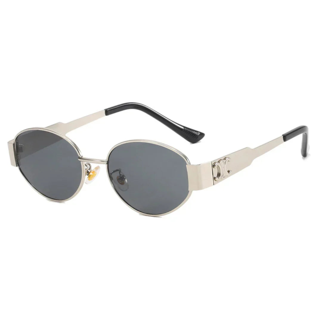 A pair of elegant women's sunglasses with a chic oval frame and stylish detailing, perfect for enhancing any outfit and providing essential UV protection. Designed for a lightweight and comfortable fit, ideal for daily wear or special occasions.