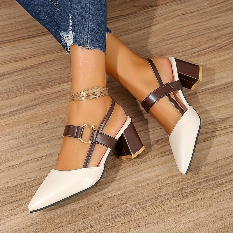 A pair of Sophia Women's Elegant Block Heel Shoes with a stylish double-strap design and pointed toe, worn by a person. These heels feature a comfortable block heel, perfect for adding elegance to both casual and formal outfits.