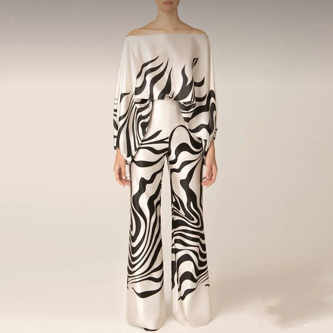 Women's summer jumpsuit with a flowing, one-shoulder design featuring vibrant patterns. Perfect for casual outings, beach days, or evening events, combining elegance and comfort for a chic summer look.