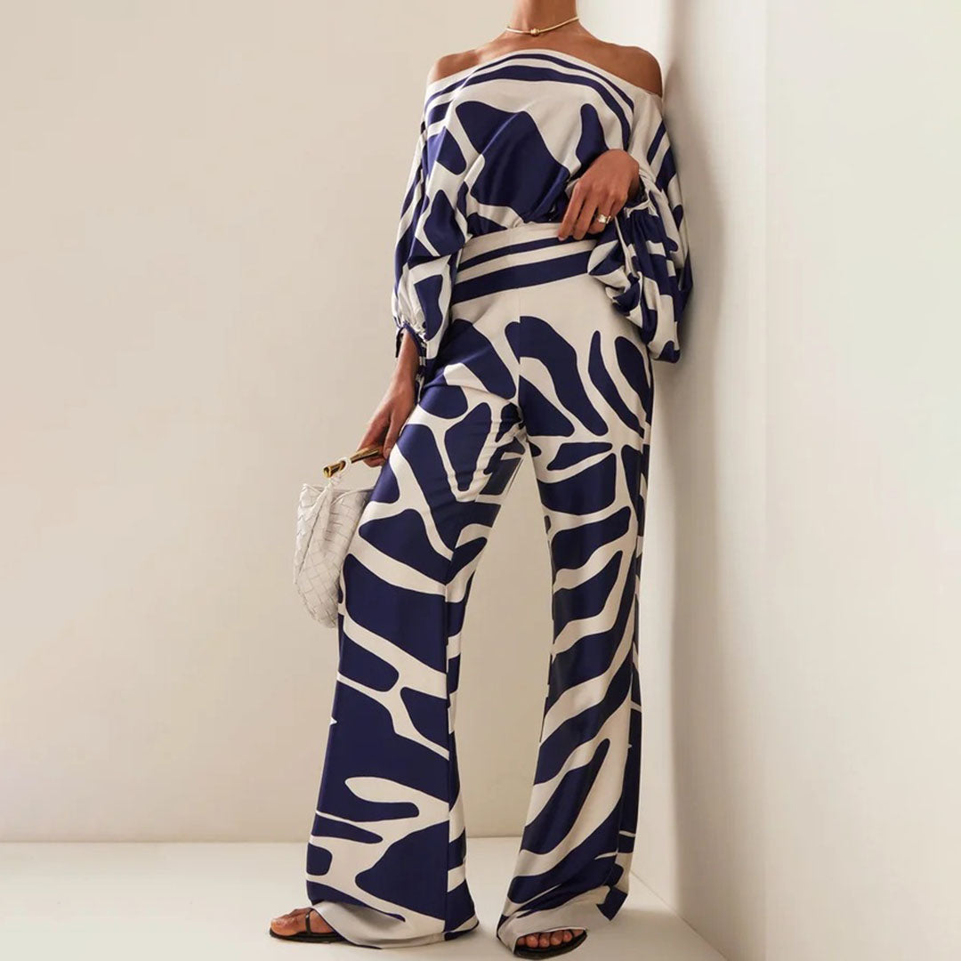 Women's summer jumpsuit with a flowing, one-shoulder design featuring vibrant patterns. Perfect for casual outings, beach days, or evening events, combining elegance and comfort for a chic summer look.