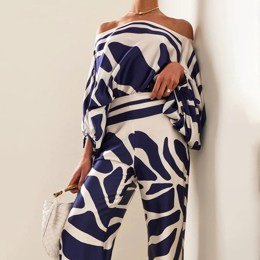Women's summer jumpsuit with a flowing, one-shoulder design featuring vibrant patterns. Perfect for casual outings, beach days, or evening events, combining elegance and comfort for a chic summer look.