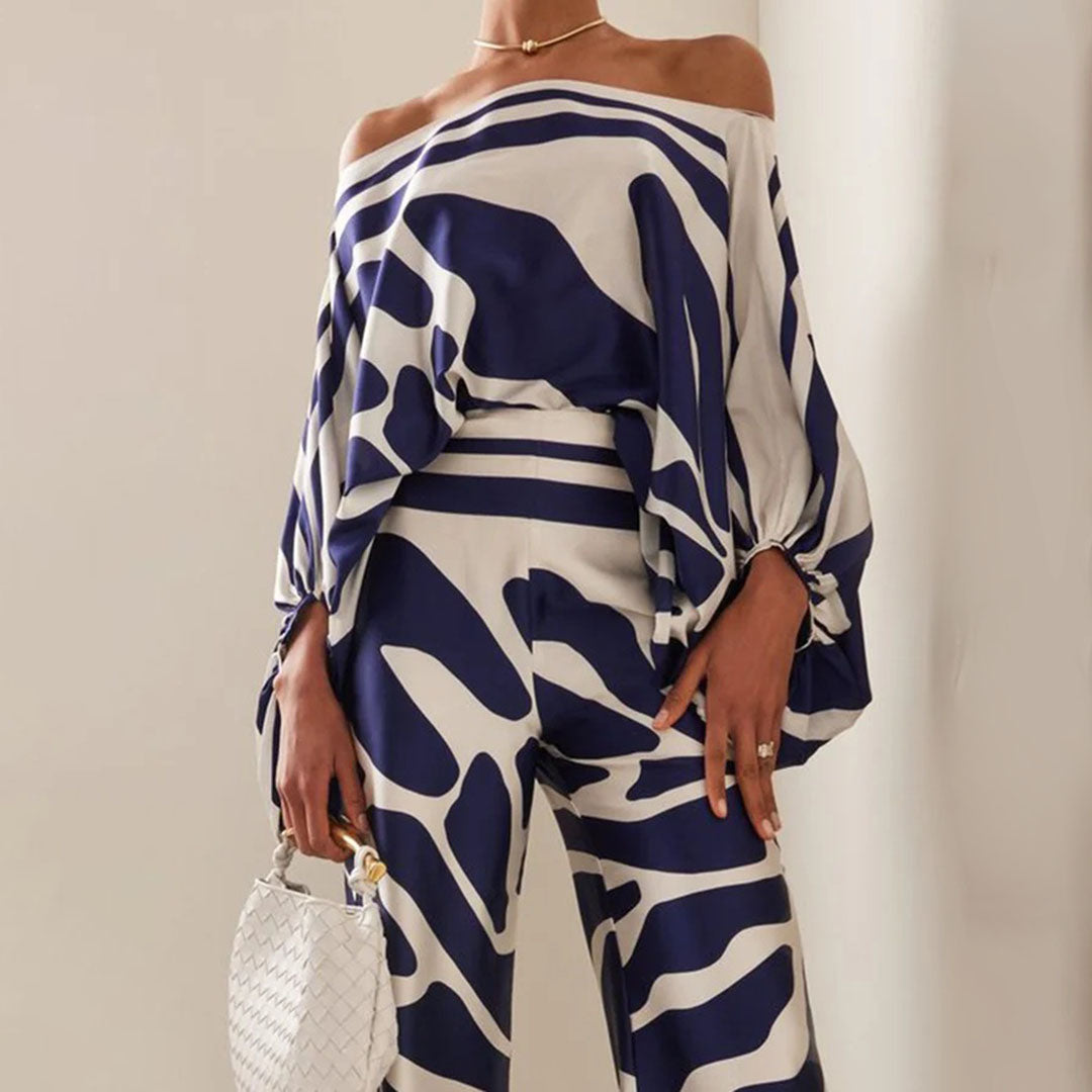 Women's summer jumpsuit with a flowing, one-shoulder design featuring vibrant patterns. Perfect for casual outings, beach days, or evening events, combining elegance and comfort for a chic summer look.