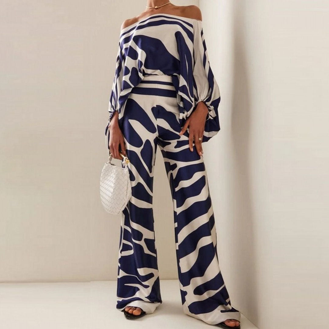 Women's summer jumpsuit with a flowing, one-shoulder design featuring vibrant patterns. Perfect for casual outings, beach days, or evening events, combining elegance and comfort for a chic summer look.
