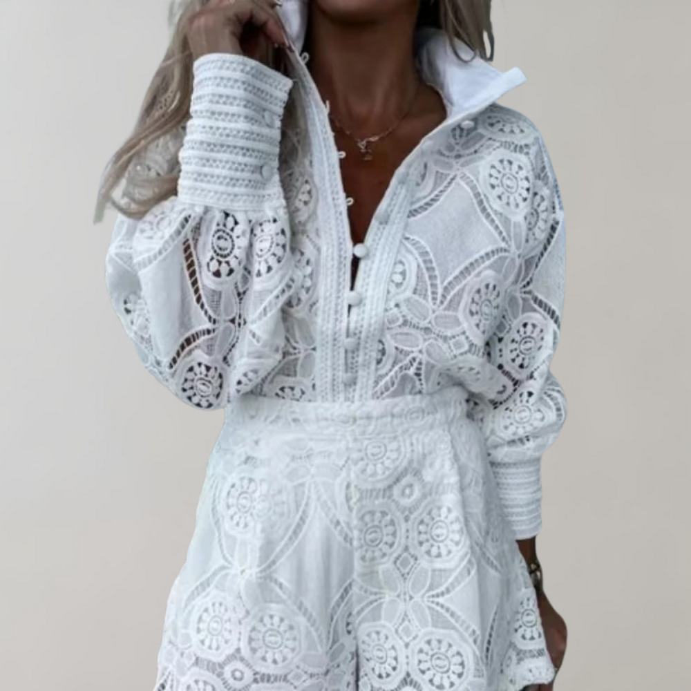 Women's elegant lace dress featuring intricate detailing, long sleeves, a fitted waist, and a flared skirt for a chic and sophisticated look.