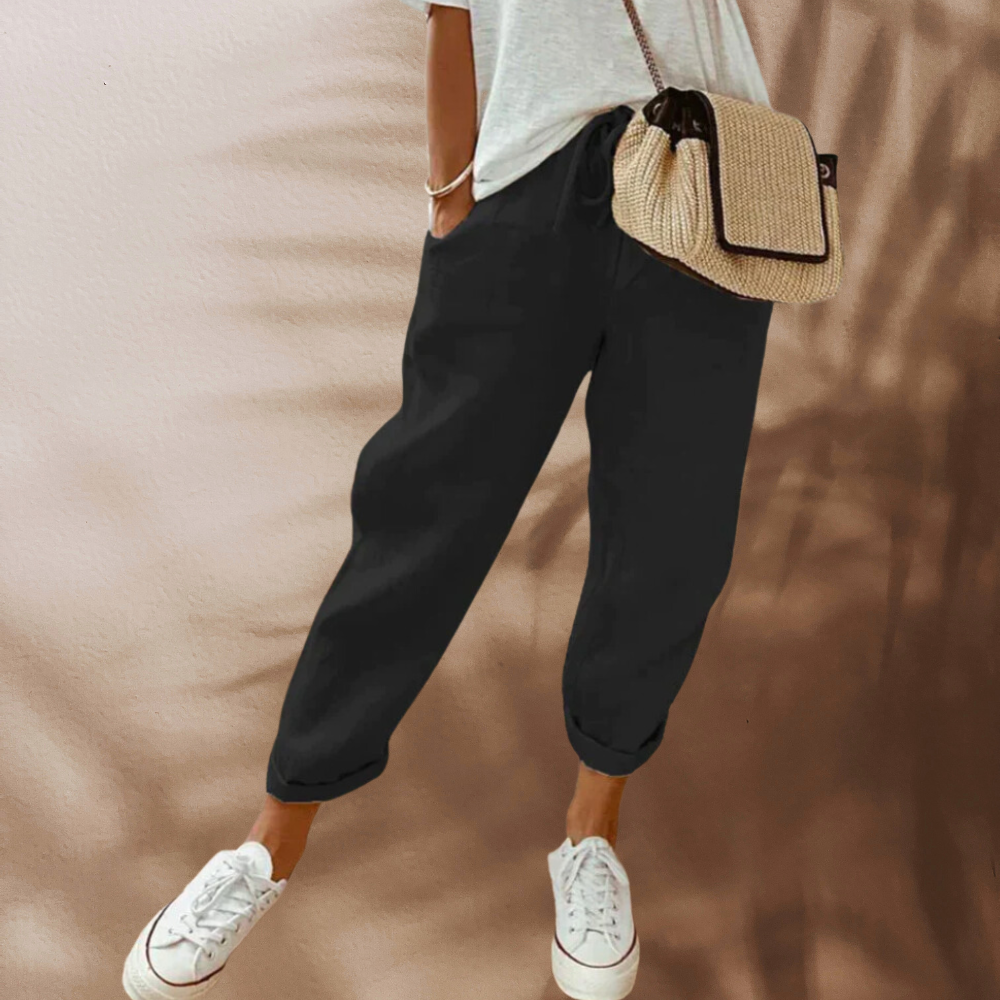 Woman wearing casual linen pants with a relaxed fit, featuring an adjustable drawstring waistband, perfect for everyday comfort and style.