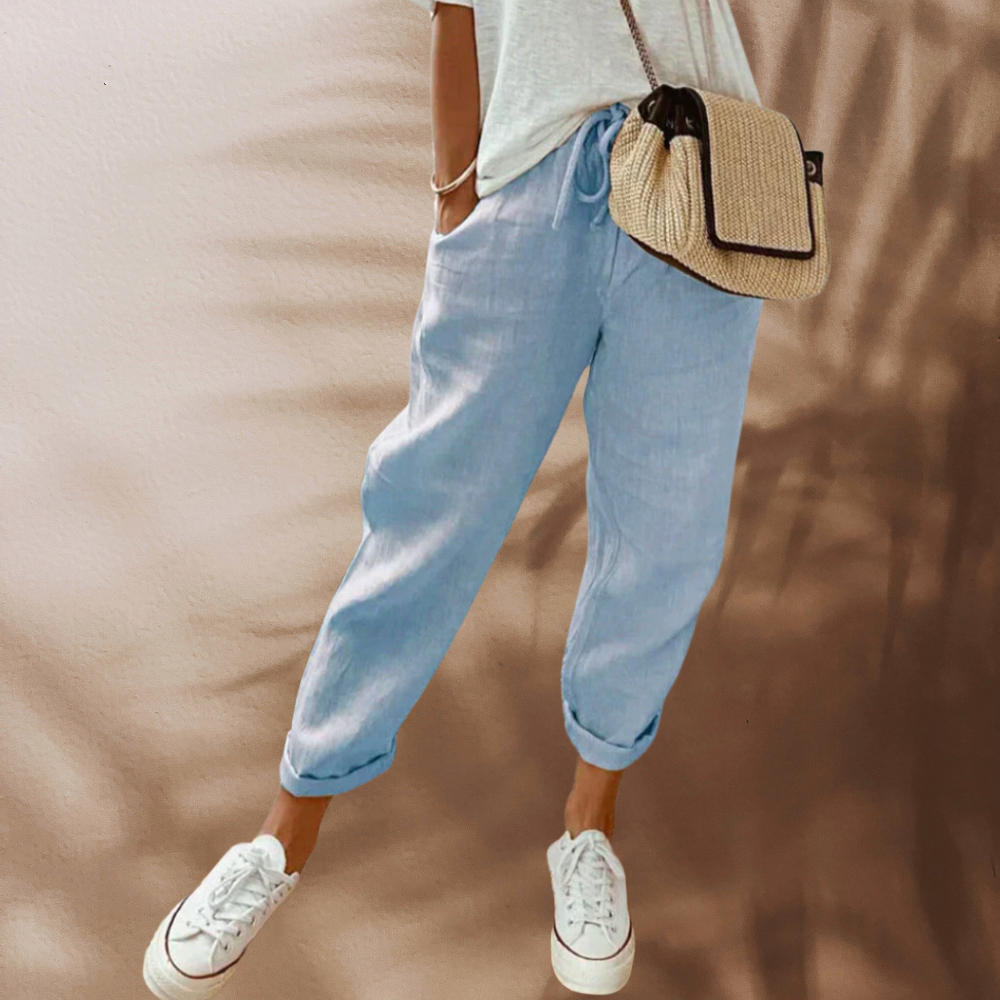 Woman wearing casual linen pants with a relaxed fit, featuring an adjustable drawstring waistband, perfect for everyday comfort and style.
