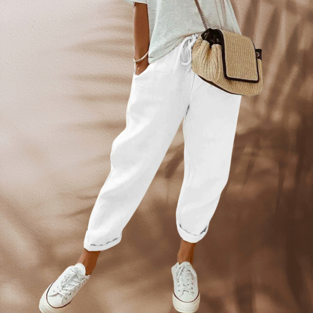 Woman wearing casual linen pants with a relaxed fit, featuring an adjustable drawstring waistband, perfect for everyday comfort and style.