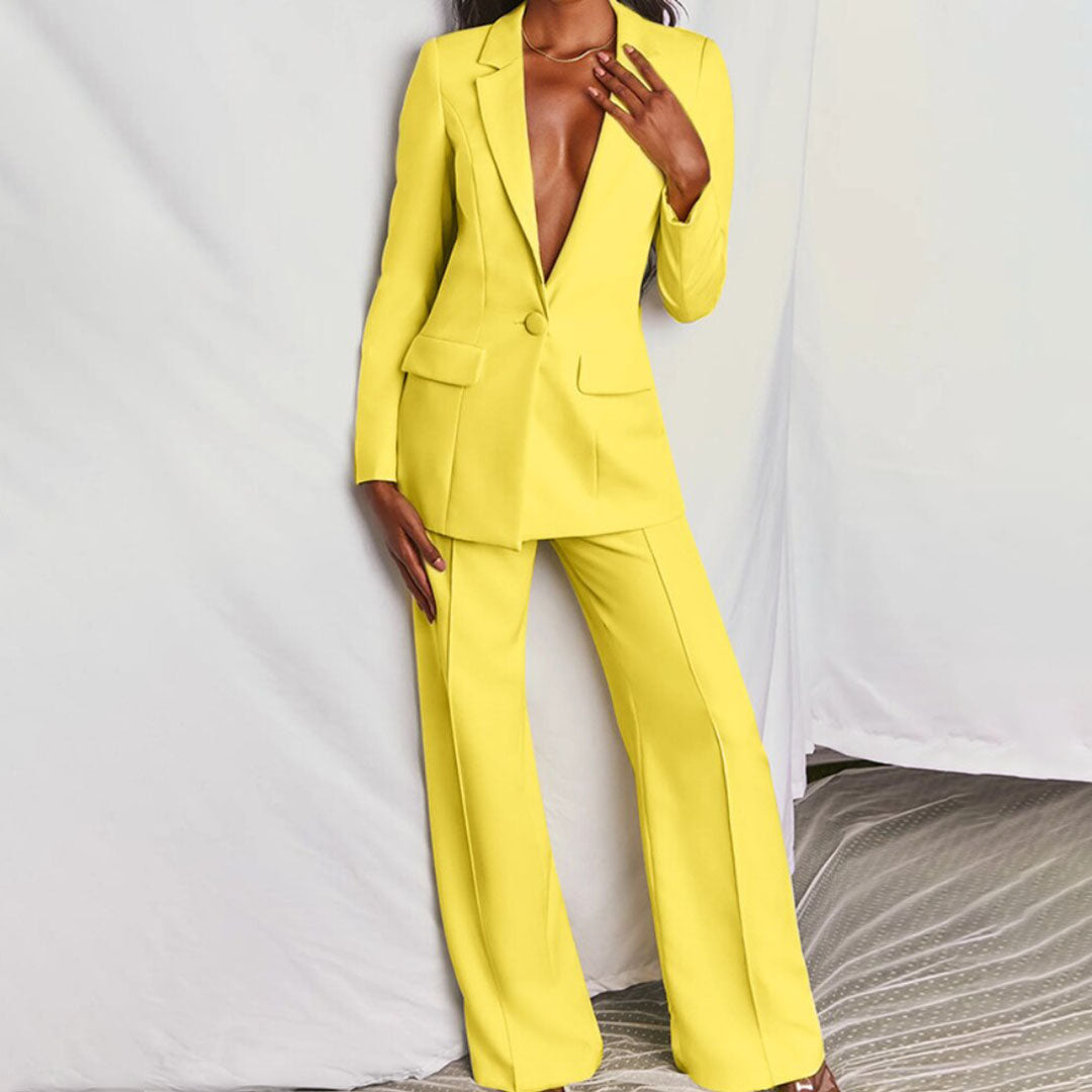Model wearing the Victoria | Tailored Wide-Leg Blazer Set, featuring a sharp, structured blazer paired with elegant wide-leg pants. This chic set offers a sophisticated and powerful look, perfect for formal events or business occasions.