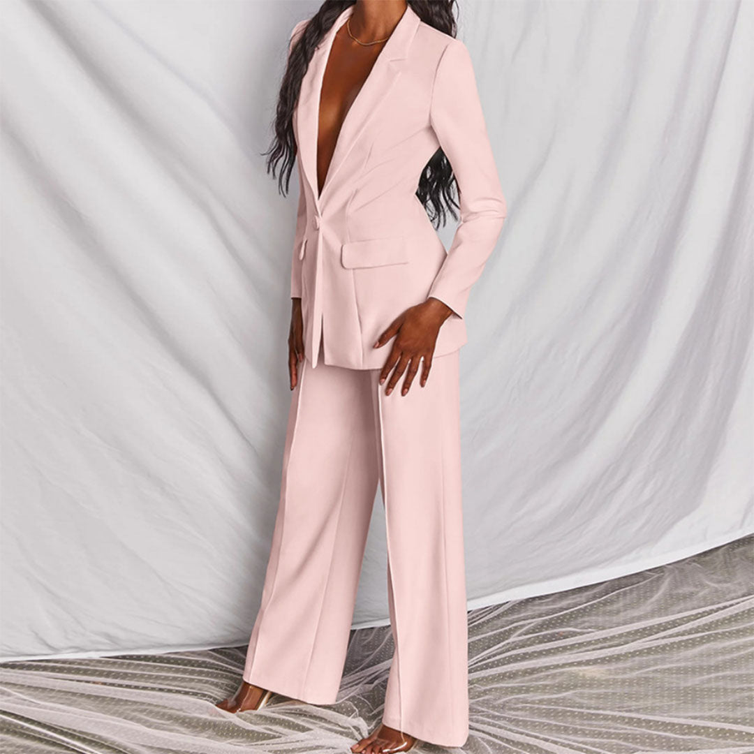 Model wearing the Victoria | Tailored Wide-Leg Blazer Set, featuring a sharp, structured blazer paired with elegant wide-leg pants. This chic set offers a sophisticated and powerful look, perfect for formal events or business occasions.