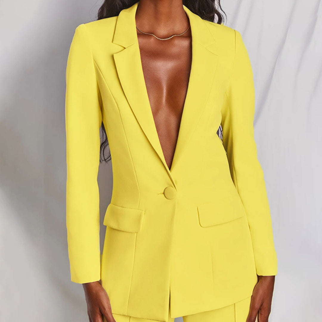 Model wearing the Victoria | Tailored Wide-Leg Blazer Set, featuring a sharp, structured blazer paired with elegant wide-leg pants. This chic set offers a sophisticated and powerful look, perfect for formal events or business occasions.