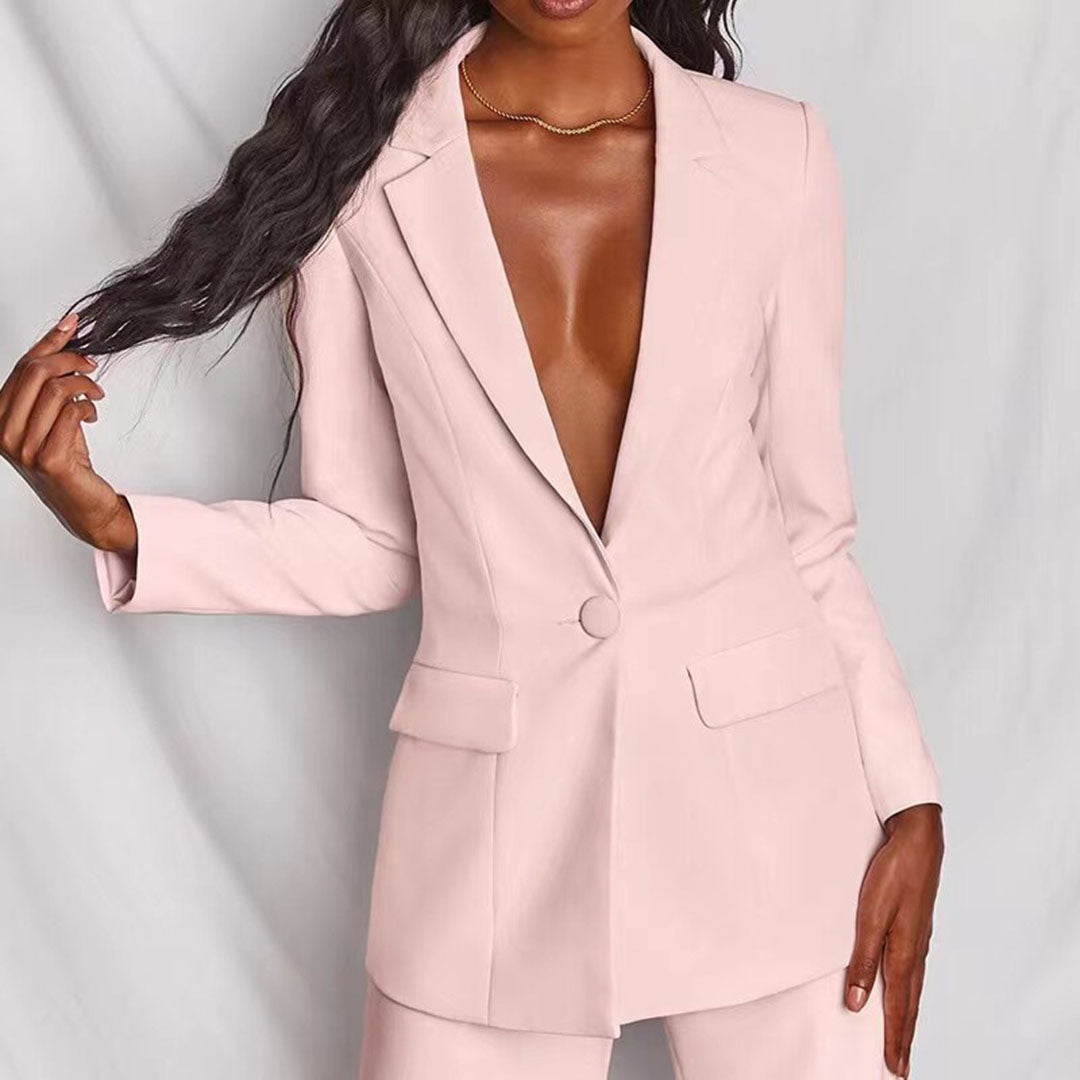 Model wearing the Victoria | Tailored Wide-Leg Blazer Set, featuring a sharp, structured blazer paired with elegant wide-leg pants. This chic set offers a sophisticated and powerful look, perfect for formal events or business occasions.