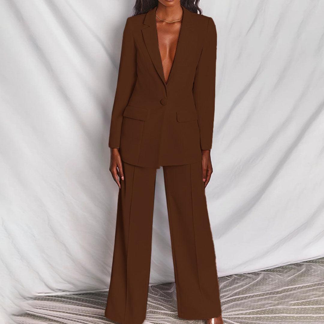 Model wearing the Victoria | Tailored Wide-Leg Blazer Set, featuring a sharp, structured blazer paired with elegant wide-leg pants. This chic set offers a sophisticated and powerful look, perfect for formal events or business occasions.