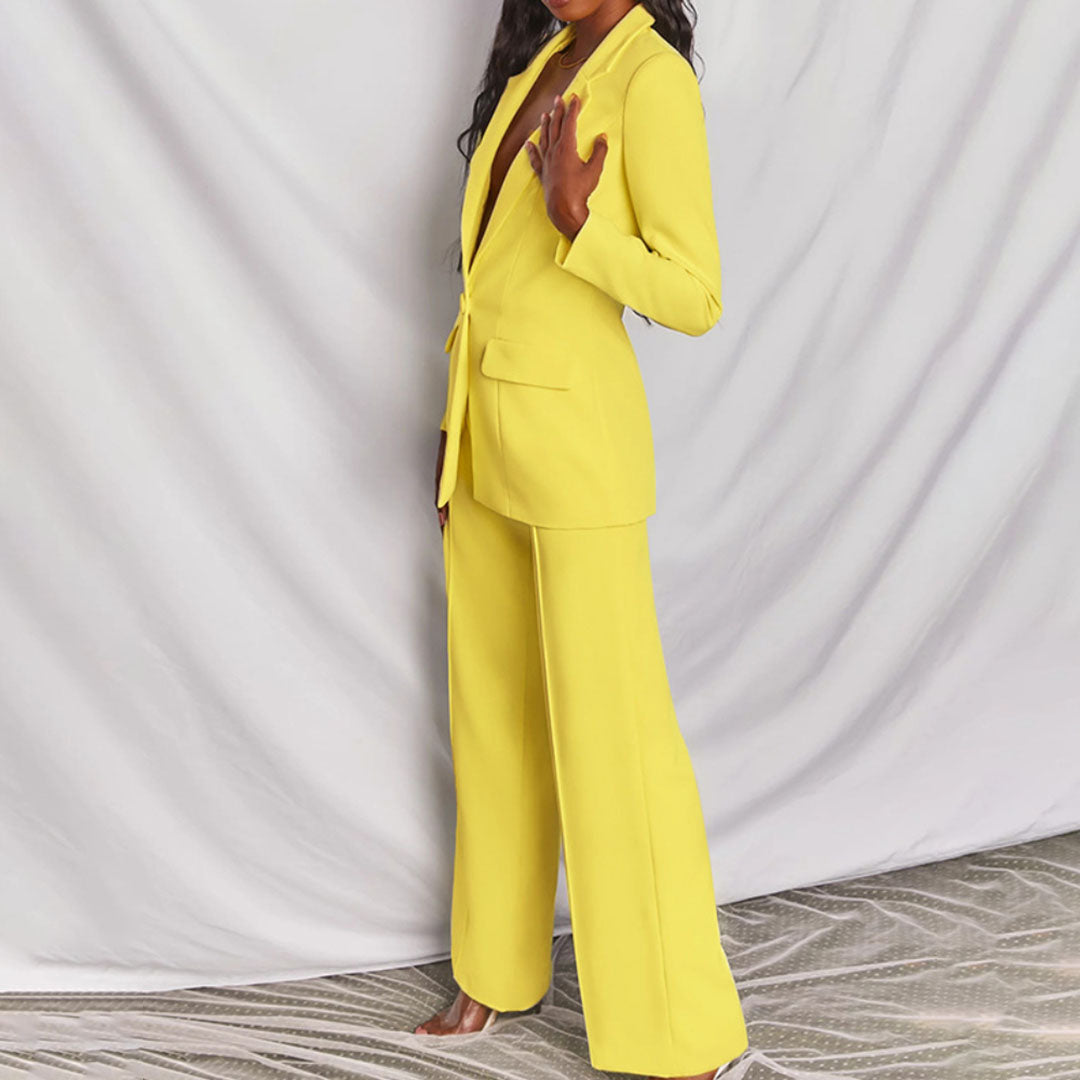 Model wearing the Victoria | Tailored Wide-Leg Blazer Set, featuring a sharp, structured blazer paired with elegant wide-leg pants. This chic set offers a sophisticated and powerful look, perfect for formal events or business occasions.