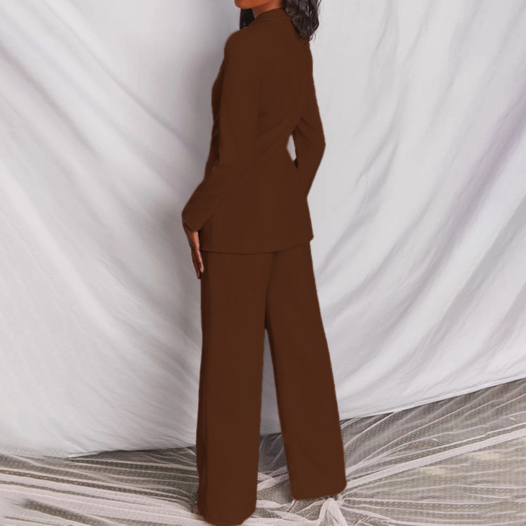Model wearing the Victoria | Tailored Wide-Leg Blazer Set, featuring a sharp, structured blazer paired with elegant wide-leg pants. This chic set offers a sophisticated and powerful look, perfect for formal events or business occasions.