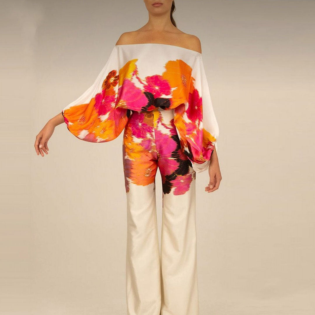 Women's summer jumpsuit with a flowing, one-shoulder design featuring vibrant patterns. Perfect for casual outings, beach days, or evening events, combining elegance and comfort for a chic summer look.
