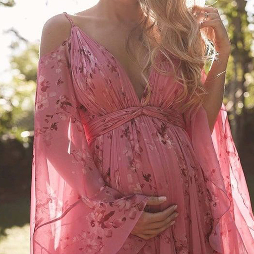 Model wearing the Isabella | Flowing Bohemian Maxi Dress, featuring a flowing silhouette and bell sleeves, perfect for capturing a romantic, free-spirited look at any special occasion or outdoor event.